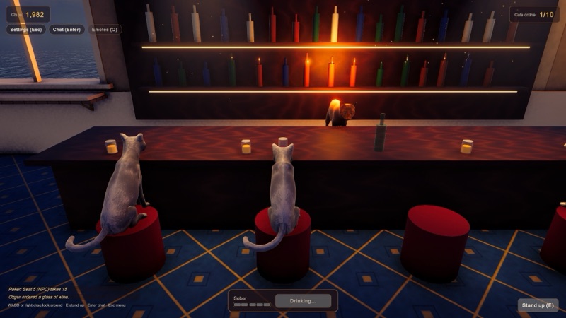 Two cats on red stools at the wine bar.